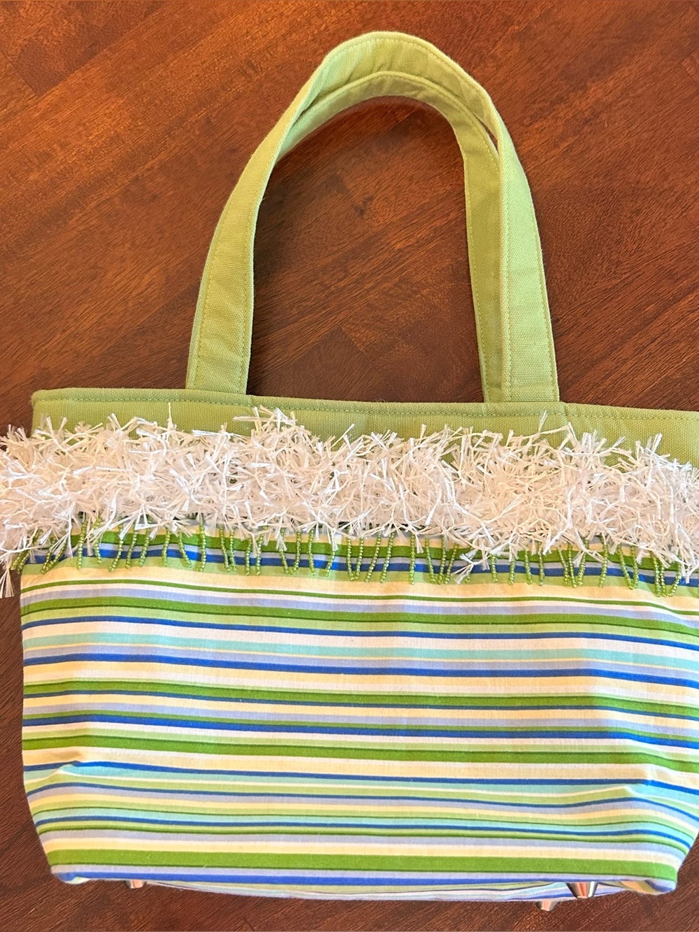 Maggie Bags Green Striped Bag with Fringe and beads. Like new. Cute inside & out